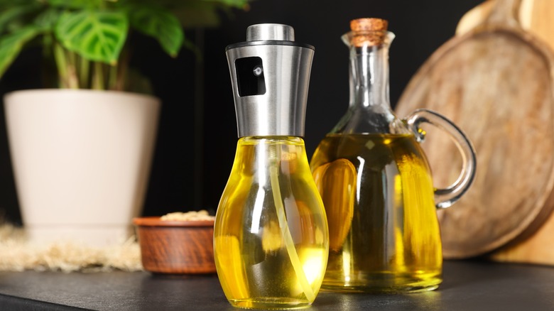 olive oil mister with jug of oil