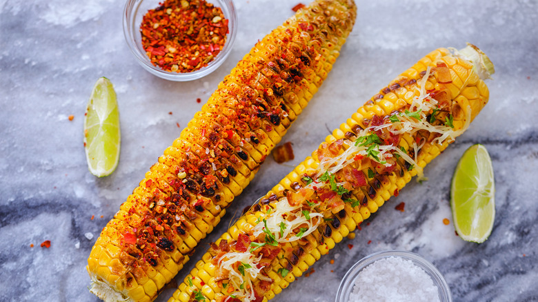 Grilled corn with various toppings