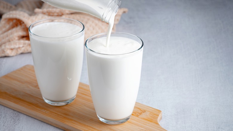 Buttermilk being poured into two glasses