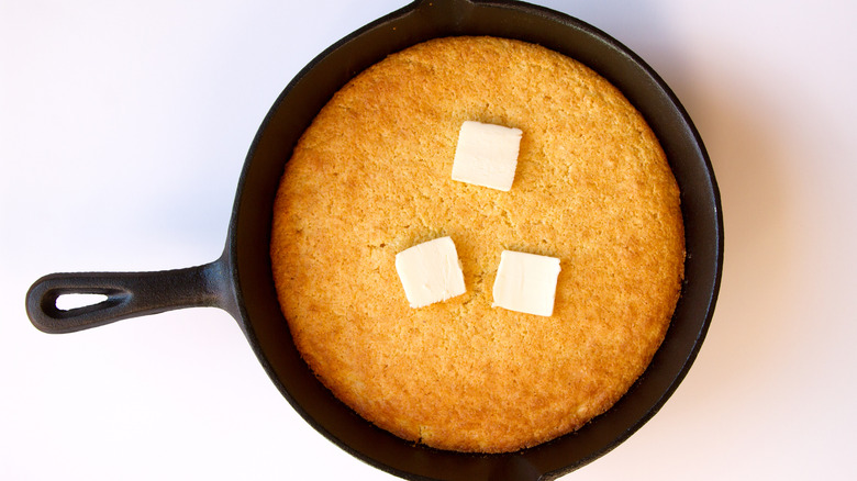 Skillet of cornbread with butter