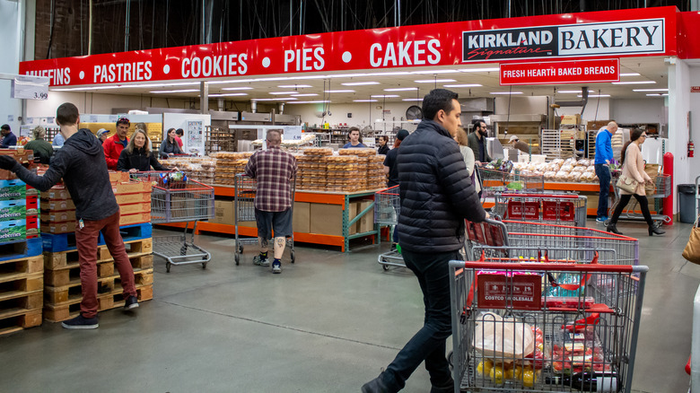 Costco members shop in the bakery section of the warehouse