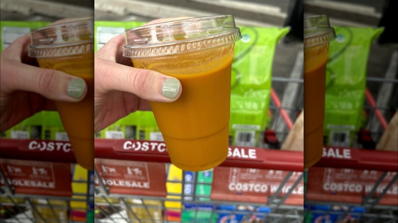 customer holding Costco's mango smoothie