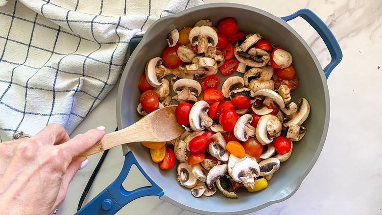 mushrooms and tomatoes in pan