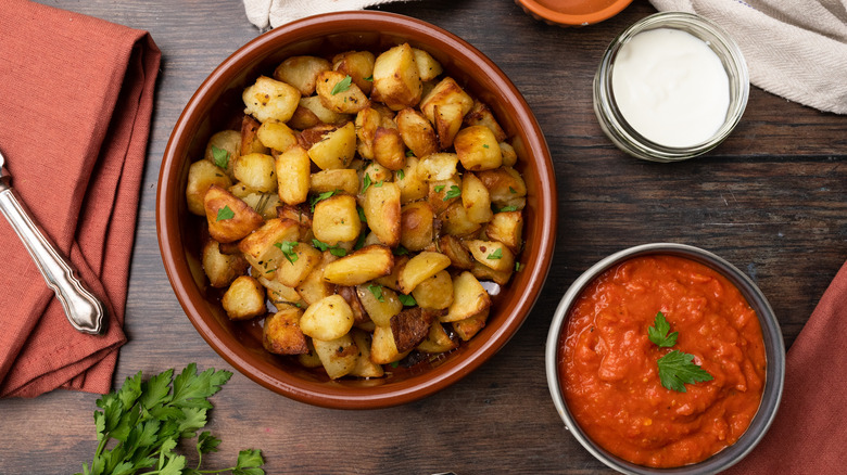 bowls of potatoes and red sauce