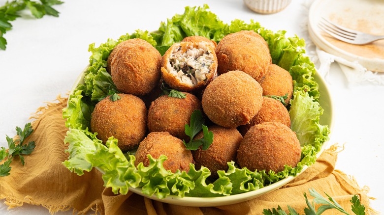 Turkey croquettes on bed of lettuce