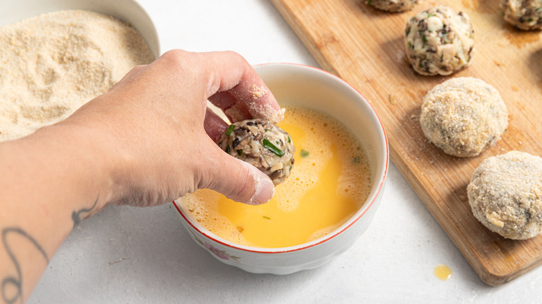 coating croquettes in egg and breadcrumbs