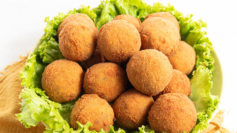 Turkey croquettes on bed of lettuce