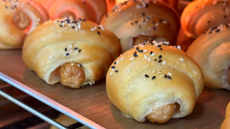 Tray of croissant-wrapped hot dogs in an oven