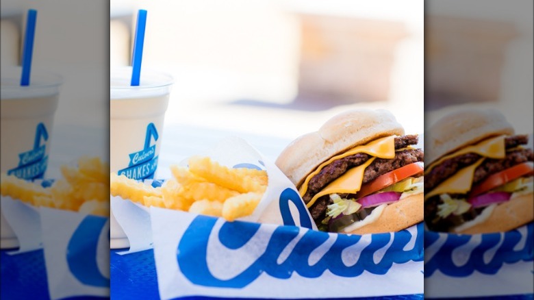 Culver's burger, crinkle cut fries, and a drink