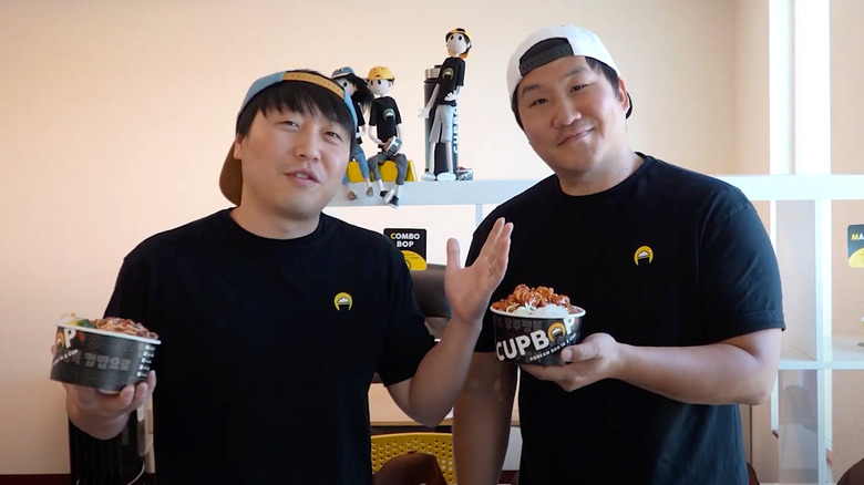 Junghun Song and Dok Kwon with two bowls of Cupbop