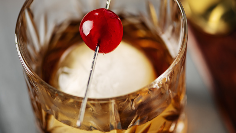 closeup of a Manhattan cocktail with a big ice cube