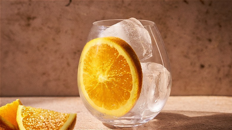 glass filled with ice and orange