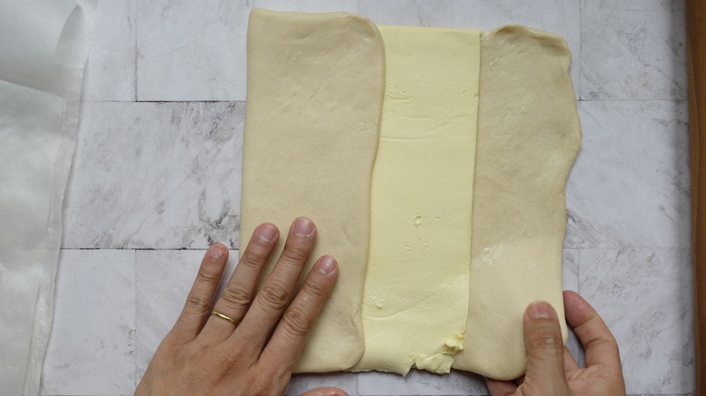 folding butter into croissant dough