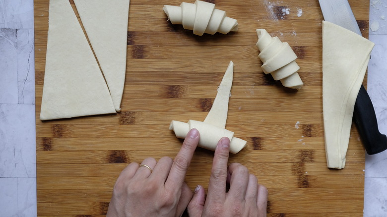 rolling up croissant dough