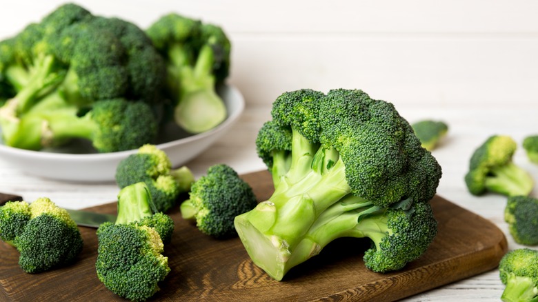 Fresh chopped broccoli on board