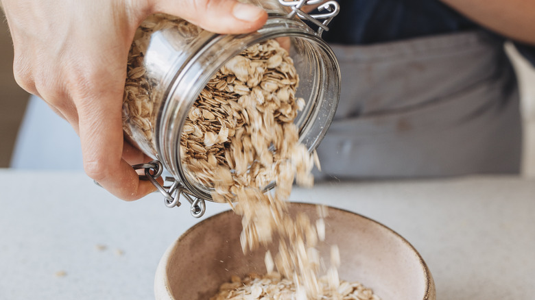 pouring rolled oats