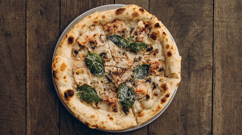 Creamy white pizza with basil