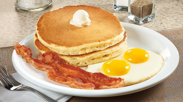 Denny's pancakes, bacon, and eggs