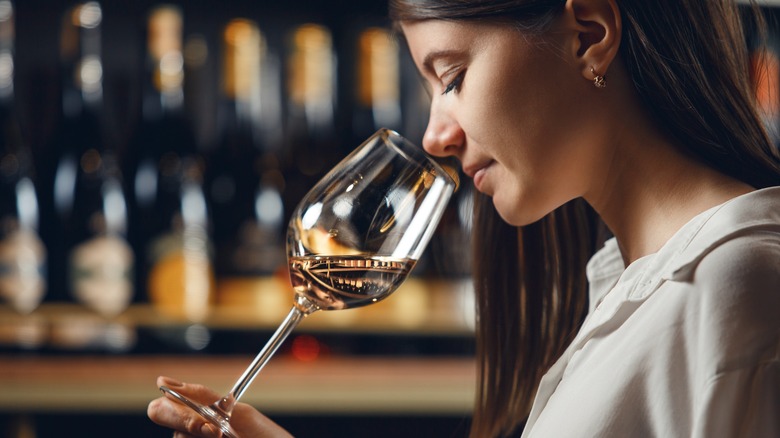 Sommelier smelling wine before tasting