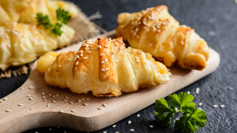 two miniature croissants with sesame seeds