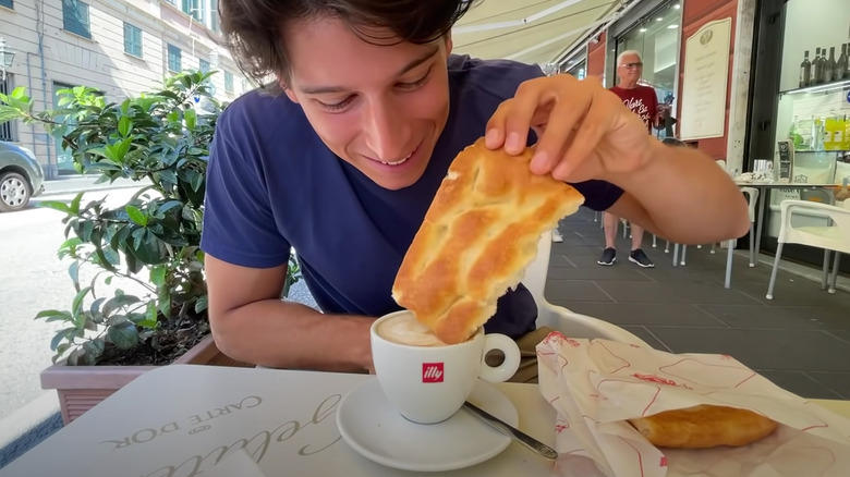 dipping focaccia into cappuccino at Genoa cafe