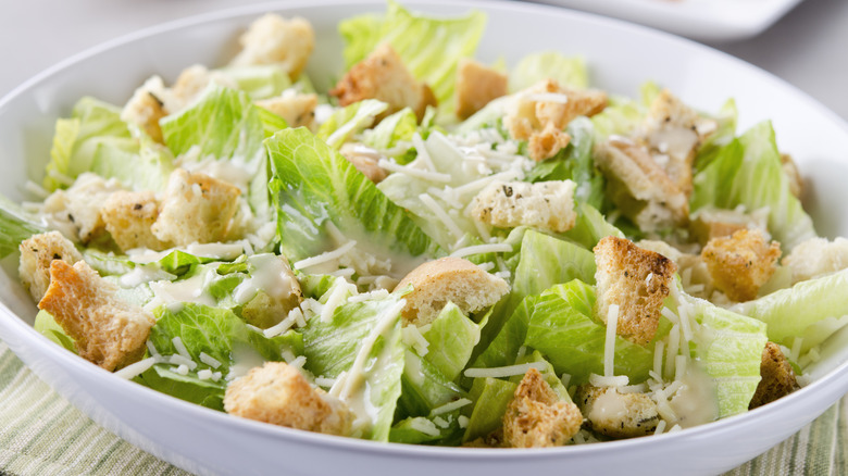 Caesar salad topped with croutons