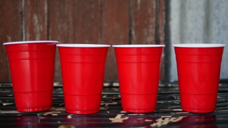 Four red solo cups lined up