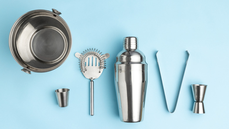 A range of silver bar tools sitting on a blue background