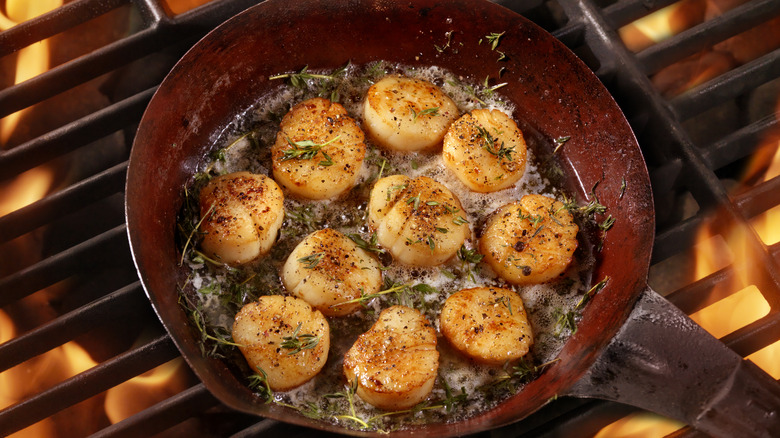 Pan seared scallops over hot grill