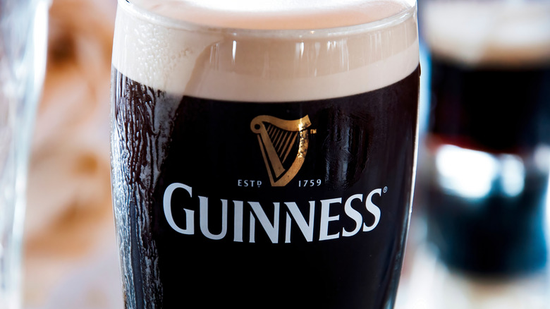 foamy draught pint of Guinness
