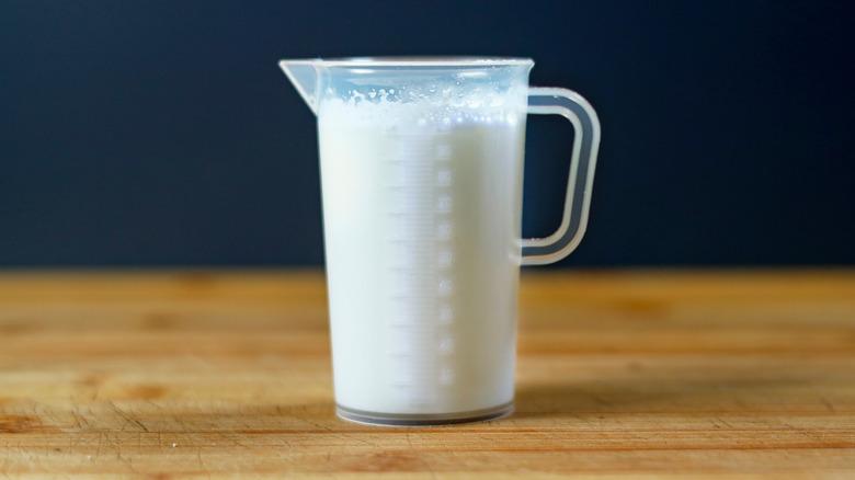 Cup of milk on a wooden table