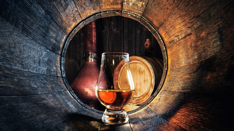 whisky glass inside a barrel