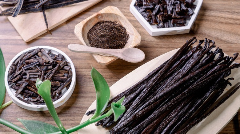 Different preparations of vanilla bean in wooden bowls 