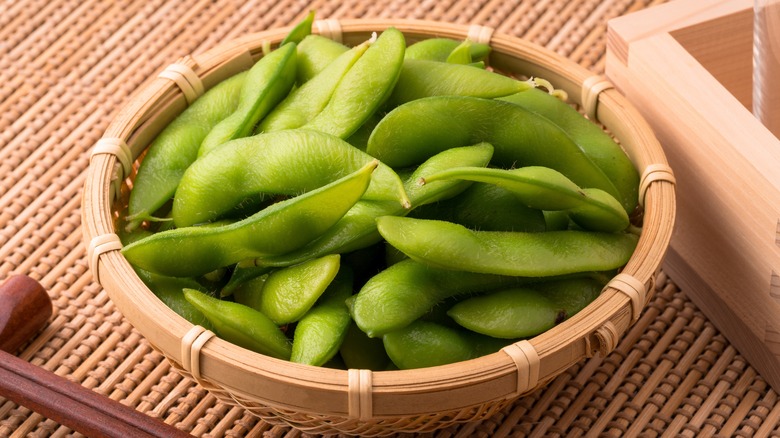 Edamame pods in wooden bowl