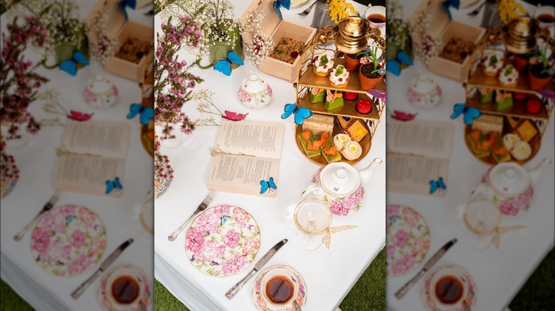 Table spread with floral plates and pastries