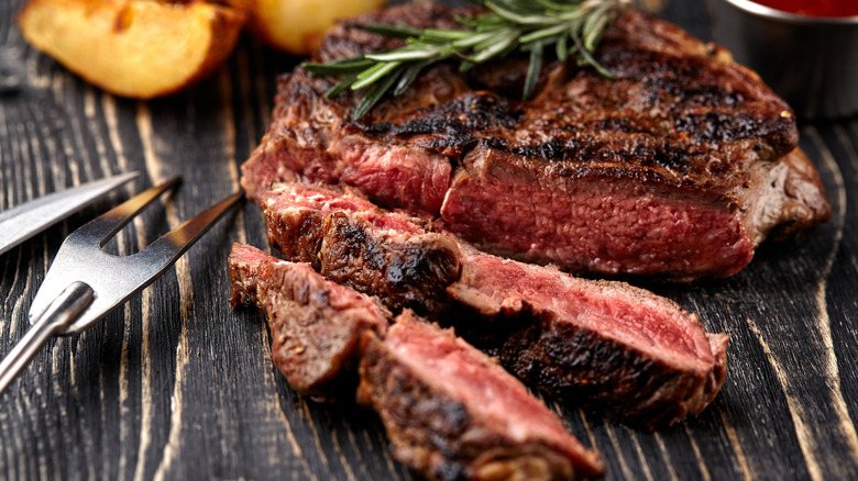 Grilled steak on wood