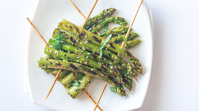 skewered asparagus on plate