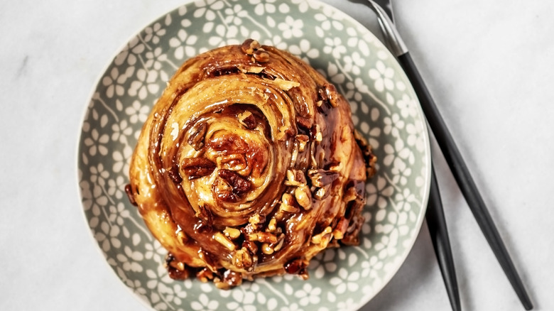 Cinnamon roll with chopped nuts