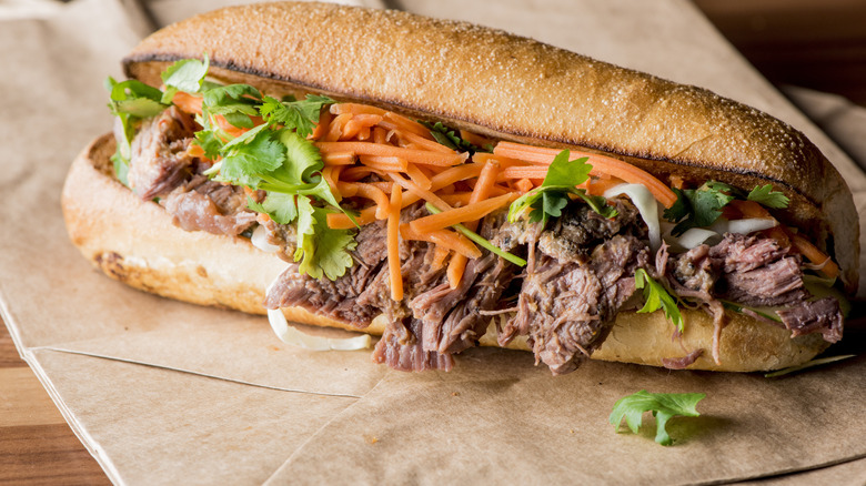 A beef banh mi with carrots and cilantro