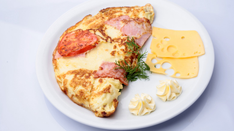 Fluffy omelet with bits of ham and cheese