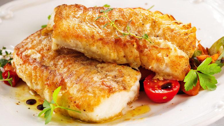 seared white fish filets on plate