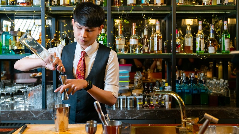bartender pouring drinks