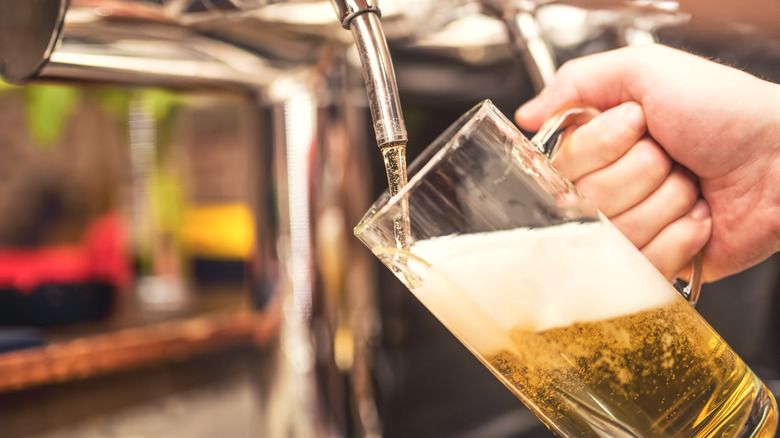 beer being poured into glass