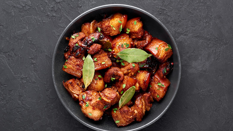 Filipino pork adobo in black bowl