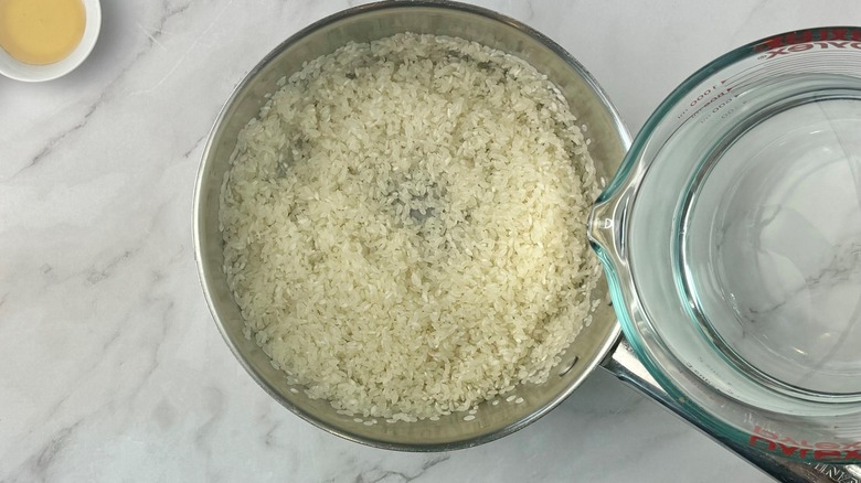 raw rice in metal pot