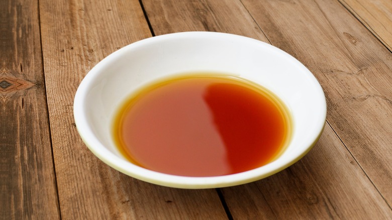 Small white bowl of fish sauce