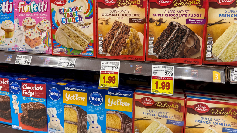 Boxed cake mixes on the shelf at the grocery store