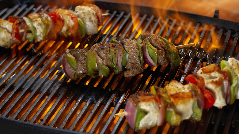 Meat and veggie kebabs on the grill