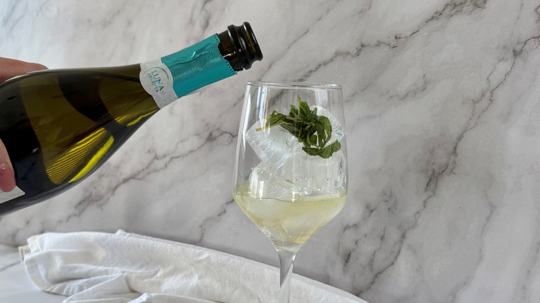 Wine bottle pouring into wine glass