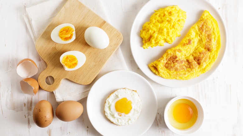 Omelet and eggs on table